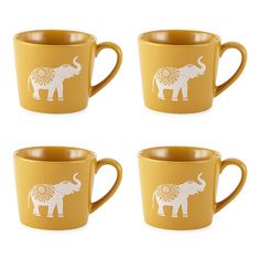 four yellow coffee cups with an elephant design on the front and sides, all decorated in white