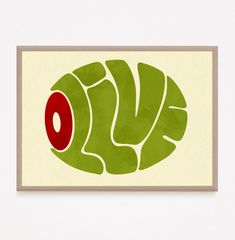 a green fish with red eyes on it's back end is framed in white paper