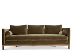 a brown couch sitting on top of a wooden frame