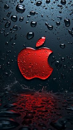 an apple logo is seen through the raindrops on a dark background with water droplets