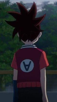 the back of a person in a red shirt and black pants looking out at trees