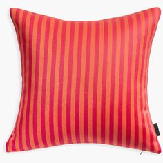 an orange and red striped pillow on a white background with a black zippered closure