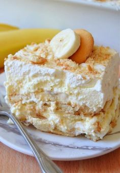 a piece of cake on a plate with bananas