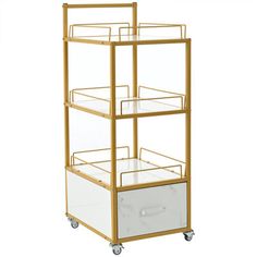 a three tiered cart with drawers and wheels on the bottom shelf is shown in gold