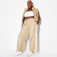 Full-length track pants from Wild Fable™ in a high-rise cut. Side pockets help keep small items handy. Made from soft and stretchy fabric in a relaxed fit. Full elastic waistband with drawstring helps keep it in place. If you're not satisfied with any Target Owned Brand item, return it within one year with a receipt for an exchange or a refund. Wild Fable™: A look for every story. Shipt Shopper, Wide Leg Sweatpants, Bottom Clothes, Wild Fable, Casual Fits, Small Items, Stretchy Fabric, Bottoms Pants, Game Day