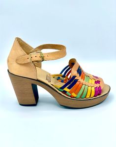 Fun is the name, comfy is the game! This colorful combo includes style and comfort. Wear these heels all day, all night, or just to show off your radiant bright side! Genuine leather Light tan with intermittent woven color- pink, yellow, teal, orange and blue Made in Mexico Rainbow Open Toe Platform Heels, Rainbow Round Toe Platform Heels, Rainbow Platform Heels With Round Toe, Multicolor 4-inch Heel Closed Toe Heels, Multicolor Closed Toe Heels With 4-inch Heel, Rainbow Heels With Round Toe For Summer, Multicolor 4-inch Leather Heels, Orange Round Toe Heels With Stacked Heel, Multicolor Sandals With Padded Block Heel