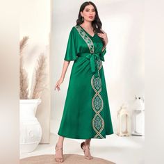 Elegant Green Floral Front Kaftan. It’s Belted, Has A V-Neck, Batwing Sleeve, And Made Of 100% Polyester. It Has A High Waist And Flared Hem. It Can Be Machine Washed. Do Not Dry Clean. This Item Ships Immediately Worldwide! Bohemian V-neck Dress With Tie Waist, Green V-neck Maxi Dress With Tie Waist, Bohemian Midi Dress With Tie Waist And V-neck, Green Surplice Neckline Dress With Tie Waist, Elegant Short Sleeve Dresses For Eid, Green Dress With Tie Waist And Surplice Neckline, Spring V-neck Kaftan With Tie Waist, Spring V-neck Tie Waist Kaftan, Spring Season V-neck Kaftan With Tie Waist