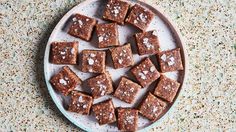 there are many pieces of brownies on the plate