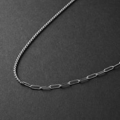 Waterproof and tarnish free  Hypoallergenic - No green skin  316L premium stainless steel Modern Out's Clip Box Hybrid Chain Necklace is forged in solid premium steel and is designed to be worn alone or layered with other chains. This chain is 50/50 clip chain and box chain. This men's chain necklace is waterproof, tarnish proof and hypoallergenic.  The Clip Chain portion can act as an extender so you can wear the chain necklace shorter if you desire. 4mm clip chain 3mm box chain 24 inches long Made of stainless steel ► International orders are subject to tax/duty fees. This is uncontrollable on our end. Shipping can take up to 6 weeks due to customs. ► There are no returns/exchanges on sale items, personalized items, earrings, and custom length chains. ► For more information, please read Silver Stainless Steel Paperclip Chain Necklace, Silver Tarnish Resistant Chain Necklace With Rectangular Links, Stainless Steel Box Chain Link Necklace, Silver Tarnish-resistant Chain Necklace With Rectangular Links, Minimalist Stainless Steel Cable Chain Necklace, Green Skin, Mens Chain Necklace, Silver Chain Necklace, Chains For Men