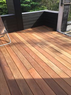 a chair sitting on top of a wooden deck