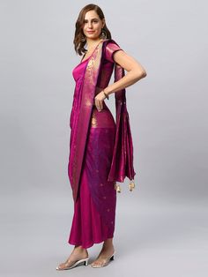 Is it a Saree or is it a Sarong? You decide! The Rubia Magenta Sarong Saree is made of luxurious Banarasi Saree and is designed in a fully wrap-around, tie and go style - as easy as a wrap-around skirt, as sophisticated as a saree! The blouse is optional and sold separately. Watch the video to see how easy it is! About this Product Sarong Saree: Saree Color: Pink and Navy Tie-dye Saree Fabric: Modal Satin Type of Work: Shibori Sizing: comes in 2 free & adjustable sizes Blouse: Included Blouse Style: As seen in Image - Custom blouse available on request Blouse Color: Pink Blouse Fabric: Modal Satin Blouse Material: 0.8 meters Steps To Wear Guide: Place the label on the center back Wrap the skirt around & put the waist band belt through the buttonhole from inside to outside & tie it on your Brocade Pre-draped Saree With Traditional Drape, Traditional Pre-draped Saree For Formal Events, Semi-stitched Brocade Pre-draped Saree, Elegant Pre-draped Saree With Dupatta In Brocade, Elegant Choli With Self Design For Traditional Ceremonies, Elegant Brocade Pre-draped Saree With Dupatta, Elegant Pre-draped Brocade Saree With Dupatta, Transitional Pre-draped Saree With Traditional Drape, Transitional Semi-stitched Brocade Pre-draped Saree