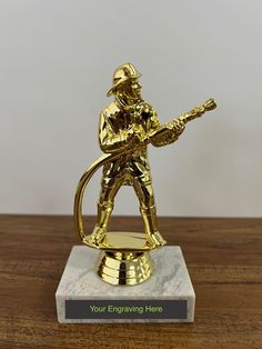 Celebrate a career of bravery and dedication with our Firefighter Retirement Award! Standing at approximately 5.5" tall, this striking award is the perfect way to honor a firefighter's years of selfless service. It features a sleek design with a custom engraved plate--measuring about 0.5" x 2.75"--where you can personalize it with a name, years of service, or a heartfelt message of appreciation. This personalized keepsake is more than just an award--it's a lasting tribute to a hero's incredible Selfless Service, Firefighter Retirement, Recognition Gifts, Appreciation Message, Retirement Celebration, Engraved Plates, Engraved Plaque, Awards Trophy, Anaheim