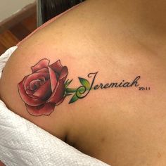 a woman with a rose tattoo on her shoulder and the words remain in cursive writing