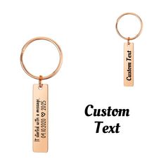 two key chains with the words custom text on them