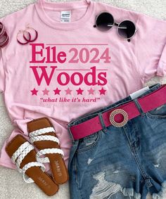 Get ready to channel your inner Elle Woods with this trendy and fun "Elle Woods 2024" graphic tee! Made with a pretty pink tee and bold hot pink print, this tee is not only stylish but also incredibly comfortable with its unisex fit and true to size sizing options ranging from YXS-4XL.
Featuring the iconic "what like it's hard" quote from Legally Blonde, this tee is sure to be a conversation piece and a funny addition to your wardrobe. Madison is wearing a M, so be sure to check out our size cha Hot Pink Print, 2024 Graphic, Black Friday Christmas, Hard Quotes, Elle Woods, Legally Blonde, Pink Tee, Graphic Shirt, It's Hard