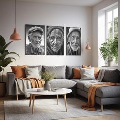 three black and white pictures hang on the wall above a gray couch in a living room