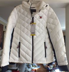 This auction is for beautiful women's Tommy Hilfiger Sorona lightweight packable hooded jacket. Size S. Brand new with tags Length: 25" (measured in the back from a collar down). Color: white. Very warm! We tried to provide as many pictures as possible to give you a full understanding of what you're looking at. Great buy! No reserve! PLEASE READ THE FOLLOWING ATTENTIVELY BEFORE BIDDING   Successful bidder agrees to pay $12.50 above the winning bid for USPS shipping, handling, and tracking to any Tommy Hilfiger Jacket Women, Girls Black Jacket, Tommy Hilfiger Jacket, Red Puffer Jacket, Black Quilted Jacket, Fur Hood Jacket, Mens Puffer Jacket, Long Puffer Coat, Tommy Hilfiger Jackets