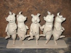 five white ceramic figurines in the shape of animals