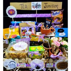 a table topped with lots of different types of food and candys on top of it