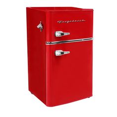 a red refrigerator freezer sitting on top of a white wall