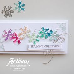 a card with snowflakes on it and the words season's greetings