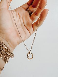 This handmade snake charm wrapped into a circle is a new favorite! shown in the photos on the bar chain, or available on a simple rolo chain as well. Mini clear cz stones as the eyes 14k gold filled chain. Everyday Metal Necklaces With Rolo Chain, Dainty Everyday Jewelry With Rolo Chain, Dainty Jewelry With Round Pendant Rolo Chain, Everyday Jewelry With Adjustable Chain And Oval Pendant, Everyday Rolo Chain Pendant Jewelry, Everyday Pendant Jewelry With Rolo Chain, Everyday Round Rolo Chain Jewelry, Everyday Rolo Chain Jewelry, Minimalist Rolo Chain Jewelry With Round Pendant