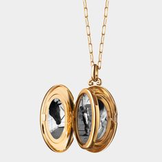 Monica Rich Kosann locket necklace. 18-karat yellow gold. Oval locket with pav diamond border. 0.336 total diamond carat weight. Locket opens to display four photos. Chain, approx. 30"L. Pendant drop, approx. 1.3"L. Lobster clasp. Imported. Diamond Locket, Monica Rich Kosann, Travel Size Perfume, Oval Locket, Gold Locket, Cleanser And Toner, Locket Necklace, The Four, Shoe Sale