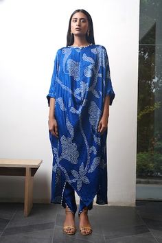 Blue batwing sleeves asymmetric hem kurta with all over bandhani tulip pattern and cowrie shells, metal coins embellishments on the neckline. Paired with a dhoti pant. - Aza Fashions Blue Traditional Drape Kurta For Summer, Kurta With Dhoti, Tulip Pattern, Stylish Lifestyle, Pant Women, Pant For Women, Dhoti Pants, Kurta Dress, Cowrie Shells