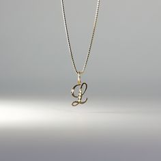 A timeless piece that will never go out of style. This 14K gold calligraphy pendant is the perfect and most stunning way of keeping a name close to your heart. We handmade each piece so you can assure you're getting a one-of-a-kind pendant that is not like any other. This 14K solid gold letter pendant is flawlessly crafted to look super chic and elegant around your neck. Pair it with a nice gold chain and wear it with almost all of your outfits. The piece is such a versatile lettering necklace. Elegant Yellow Gold Name Necklace With Box Chain, Elegant Nameplate Box Chain Jewelry, 14k Gold Initial Pendant Jewelry With Box Chain, Yellow Gold Jewelry With Initial Pendant Box Chain, Elegant Initial Necklace With Box Chain As Gift, White Gold Pendant Name Necklace, 14k Gold Initial Pendant Necklace With Box Chain, Yellow Gold Box Chain Necklace With Initial Pendant, Gold Name Necklace With Box Chain For Anniversary