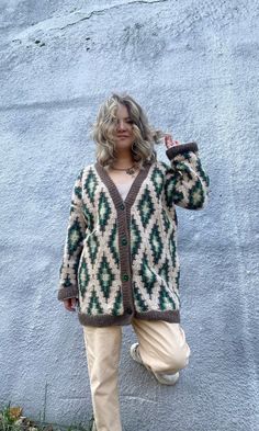 Hand knit Ikat cardigan. Super oversized cardigan. Unisex chunky knit coat. Cozy granny square cardigan. Large cardigan for men and women.  Available for order in one size: width: 27.5"/70 cm length: up to 31.5"/80 cm sleeve: 23.6"/60 cm Choose from wide range of colors to create your own super cardi. Colors can differ because of the personal screen color reception. Choose one primary color and contact me for secondary colors. Will be shipped within 3-4 working weeks by airmail. Tracking will be available. Your order will be packed securely into a carton box. We provide eco-packing. Handwash only. Dry flat. Steam. Do not bleach. Do not iron. Keep folded, do not hang. WHEN YOU PLACE YOUR ORDER  YOU AGREE WITH MY SHOP POLICIES Cozy Winter Cardigan With Granny Squares, Green Granny Square Winter Cardigan, Cozy Granny Square Cardigan For Winter, Casual Granny Square Cardigan For Winter, Bohemian Chunky Knit Winter Outerwear, Cozy Winter Granny Square Cardigan, Oversized Granny Square Casual Outerwear, Cozy Oversized Crochet Outerwear, Casual Oversized Granny Square Outerwear