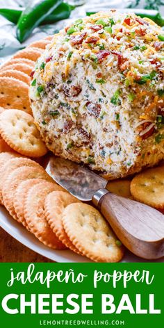 a cheese ball on a plate with crackers