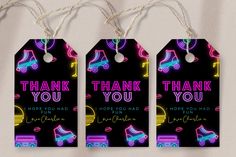 three tags that say thank you and have neon lights on them