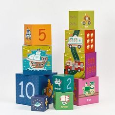 a stack of colorful blocks with numbers and vehicles on top of each block in different colors