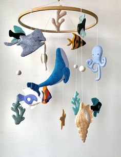 a mobile with sea animals hanging from it's sides