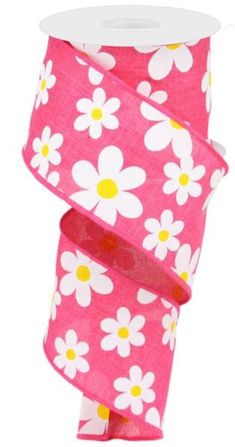 a roll of pink and white daisies ribbon with yellow dots on the end,