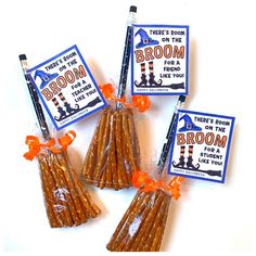 there's room on the broom candy sticks in plastic bags with orange ribbon tied around them