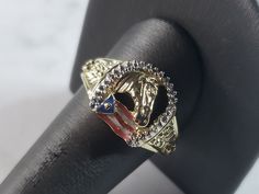 A MENS VINTAGE ESTATE 10K YELLOW GOLD HORSE SHOR RING WITH THE PUERTO RICAN FLAG.  THE WEIGHT OF THE RING IS 5.1g.  THE RING IS A SIZE 12.25.   MAKES A GREAT GIFT FOR THAT SPECIAL SOMEONE. ANY QUESTIONS, PLEASE ASK.  BE SURE TO CHECK OUT SOME OF OUR OTHER GREAT ITEMS. IF THERE ARE ANY ISSUES PLEASE CONTACT US, WE'RE ALWAYS HAPPY TO TRY TO HELP YOU OUT AS BEST AS WE CAN. Antique Gold Diamond Ring Collectible, Collectible Gold Diamond Cut Ring, Horse Shoe Ring, Puerto Rican Flag, Gold Horse, Marcasite Ring, Sterling Silver Marcasite, Horse Shoe, Mens Vintage