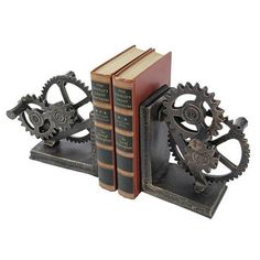 two bookends made out of metal gears and books on top of each other