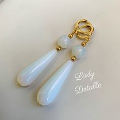 "WHITE OPAL stone Teardrop Earrings by Lady Detalle 16k gold historic Reproduction Victorian Earrings, real White OPAL stone long teardrop jewelry These real White OPAL stone Teardrop earrings are inspired by the many extant examples of the Victorian, Regency and Georgian eras! GORGEOUS naturally inclusive gorgeous semi translucent opal stones: each pair of earrings finished with 16k gold plated or silver plated LOOPS, and closely matched to coordinate well together. These have a gorgeous GLOW a Elegant Natural Stone Dangle Teardrop Earrings, Elegant Dangle Teardrop Earrings With Natural Stones, White Teardrop Pendant Earrings For Formal Occasions, White Long Drop Teardrop Earrings, White Spiritual Teardrop Earrings, Vintage White Pear-shaped Jewelry, Elegant Teardrop Earrings With Natural Stones, Handmade Elegant Long Drop Teardrop Earrings, Elegant White Earrings With Natural Stones