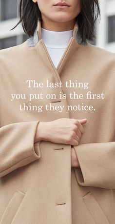 a woman wearing a beige coat with the words, the last thing you put on is the first thing they notice