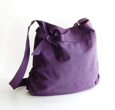 *** Please check 'shop announcement' for production time and delivery before your purchase. ***This beautiful bag made from deep purple canvas. It is sturdy and big enough to hold lots of your essentials such as wallet, ipad, mobile, keys and a few pocket books. The bag is fully lined with mustard yellow canvas. There are 2 open pockets, 1 zipper pocket, a pen slip and a key clip inside.The bag can be made with zipper closure instead of magnetic snap as shown in the listing. It also can be made Purple Canvas Shoulder Bag For Daily Use, Purple Crossbody Bag For Gift, Purple Crossbody Bag As Gift, Everyday Purple Backpack Shoulder Bag, Purple Shoulder Bag With Removable Pouch For Gift, Canvas Crossbody Bag For Gifts, Canvas Crossbody Bag With Adjustable Strap For Gift, Canvas Crossbody Bag As Gift, Canvas Crossbody Bag Gift