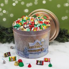 a christmas tin filled with assorted candy