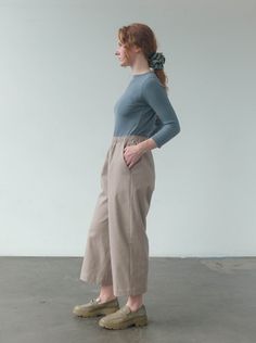 The Roz Trouser is a loose fit, pull on pant with an elastic waistband, front pockets, and slightly cropped fit. These pants are available in petite, standard, and long lengths. Model is wearing size SMALL standard length. Model is 5'7". Please review our size guide prior to ordering. Need specific measurements? Send us an email and we will be happy to help you find the perfect fit. **Customizations available by request Versatile Relaxed Fit Cropped Wide Leg Pants, Versatile Cropped Wide Leg Pants, Relaxed Fit Bottoms With Gathered Waist For Loungewear, Effortless Workwear Bottoms With Elastic Waistband, Effortless Bottoms With Elastic Waistband For Work, Relaxed Fit Cotton Bottoms With Gathered Waist, Cotton Bottoms With Relaxed Fit And Gathered Waist, Relaxed Fit Pants With Elastic Waistband For Casual Gatherings, Everyday Pull-on Cropped Pants