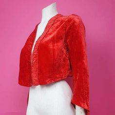 Beautiful 1930s red velvet silk lined jacket bright red fun party glam Christmas  No fastening  Measurements taken closed  Bust 36 inches Waist 36 inches Condition Has tears to the silk lining see all photos Red Festive Outerwear For Party, Festive Red Outerwear For Party, Festive Red Party Outerwear, Vintage Red Outerwear For Evening, Vintage Velvet Party Outerwear, Red Christmas Party Outerwear, Red Fitted Silk Outerwear, Red Silk Fitted Outerwear, Gold Jacket