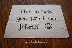 this is how you print on fabric with a smiley face in the center and words below it