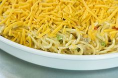 a white bowl filled with noodles and cheese