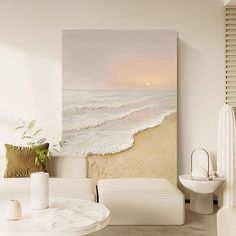 a living room with white furniture and a painting on the wall above it's coffee table