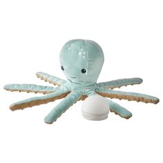 an octopus stuffed animal sitting on top of a white object