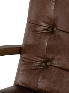 a brown leather chair with wooden armrests