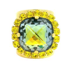 a yellow and black diamond ring on a white background